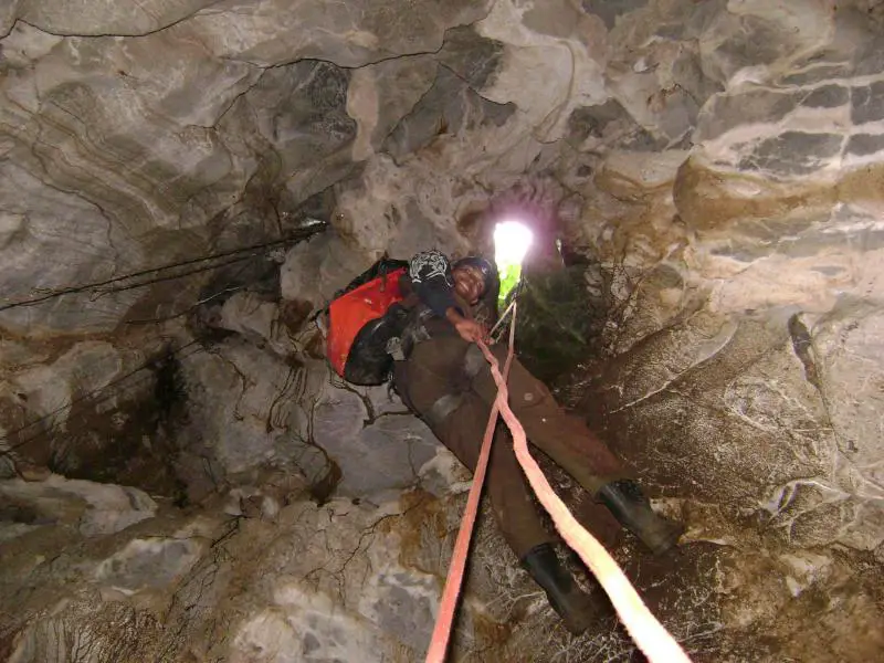 Rappelling into the cave