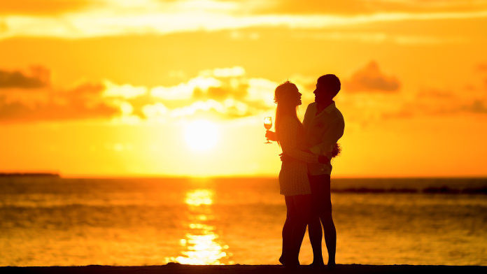 Couple on the beach at sunset